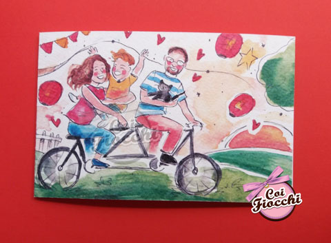 partecipazione nozze con disegno di una famiglia in bici con il gatto
