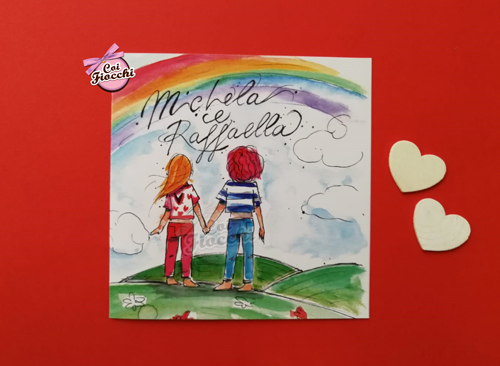 invito unione civile con disegno ad acquerello che ritrae due ragazze di spalle mentre guardano insieme l'arcobaleno