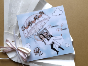 partecipazione nozze con caricatura sposi con paracadute stile manga